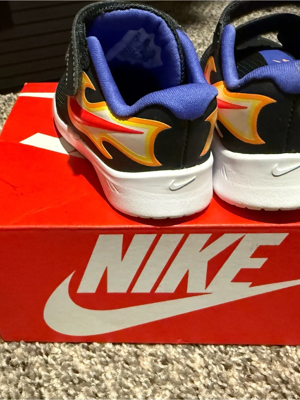 Nike Kids Black Sneakers with Red & Yellow Flame Accent